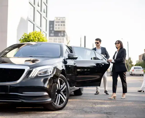 female-chauffeur-helps-business-man-get-out-car-opening-door-concept-personal-driver-luxury-taxi-business-trips_506452-21615-ezgif.com-crop
